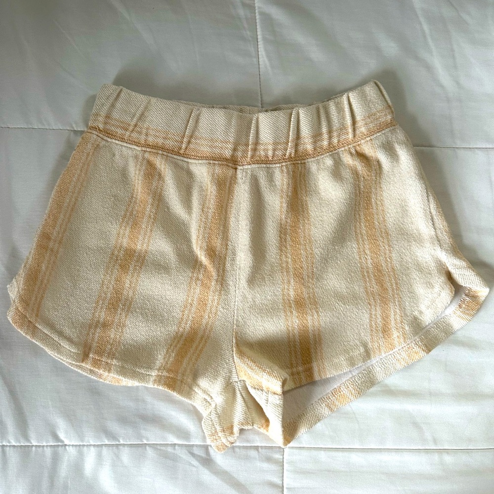 Loosely worn white and tan Roxy shorts